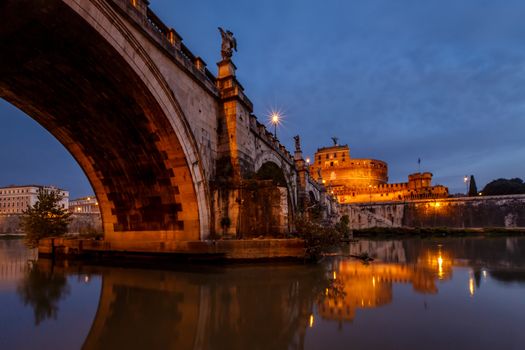 Castle of Holy Angel and Holy Angel Bridge over the Tiber River in Rome at Dawn, Italy