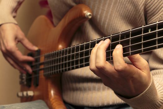 Man playing a bass guitar (Series with the same model available.)