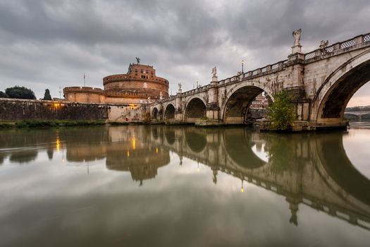 Castle of Holy Angel and Holy Angel Bridge over the Tiber River in Rome at Dawn, Italy