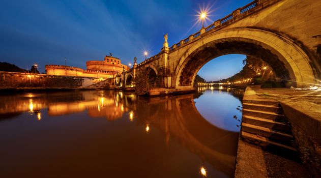 Panorama of Holy Angel Castle and Holy Angel Bridge over the Tiber River in Rome at Dawn, Italy