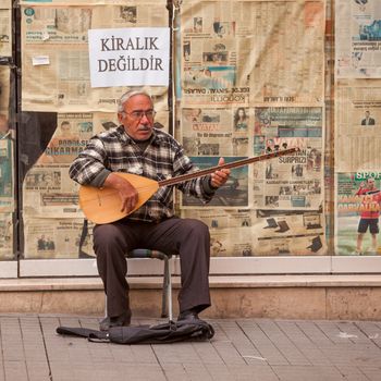 ISTANBUL, TURKEY ��� APRIL 28: Street musician performing on an oud prior to ANZAC day on April 28, 2012 in Ankara, Turkey.  Each year patriotic Turks honor those fallen at the battle of Galipoli during World War I.