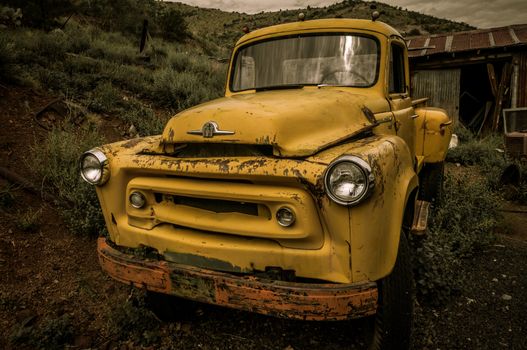 Jerome Arizona Ghost Town mine and yellow old car