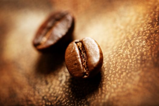 Closeup of coffee beans on wooden board