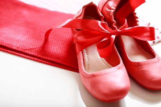 Gift wrapped girls red shoes with ribbon 