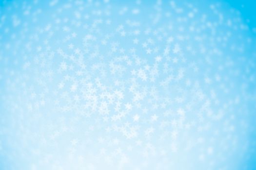 Abstract christmas blue bokeh stars background