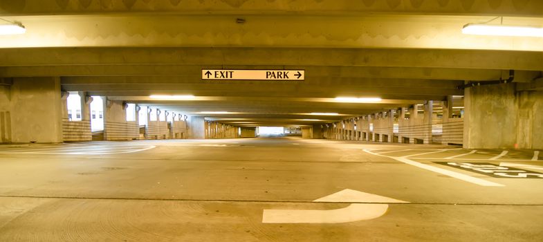underground parking structure early in the morning without cars