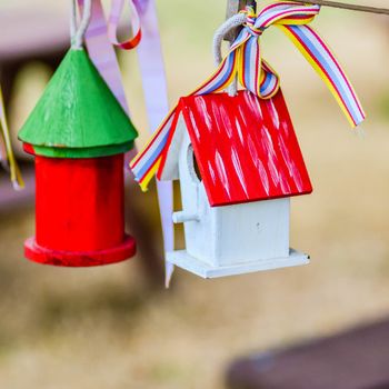 little colorful bird houses on clothes line