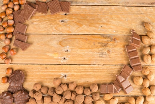 Assorted nuts and sweets on a rustic wooden table