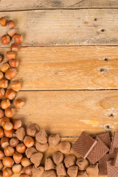 Nuts and candy displayed on a rustic wooden table