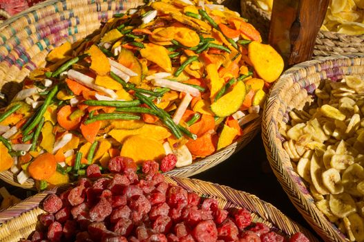 Assorted dried fruit displayed on a street market stall