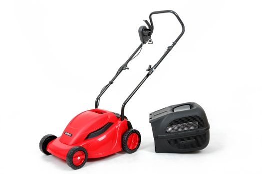 new red lawnmower isolated on white, studio shoot