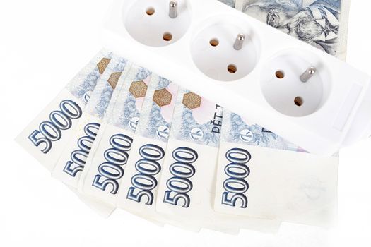 power cord and banknotes of czech crowns money concept of expensive energy bill