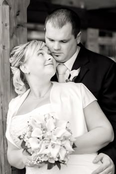 beautiful young wedding couple, bride looking to her groom, black and white tone