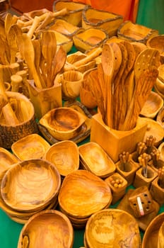 A vast assortment of handcrafted kitchen utensils as seen on a market stall