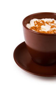 Coffee with whipped cream and cinnamon isolated on white