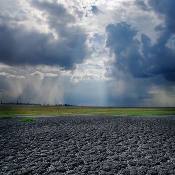 drought land and dramatic sky with clouds