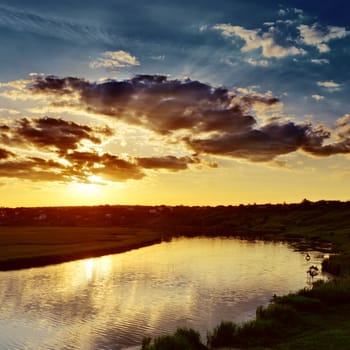 cloudy sunset over river