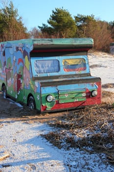 painted car freezer standing on the beach