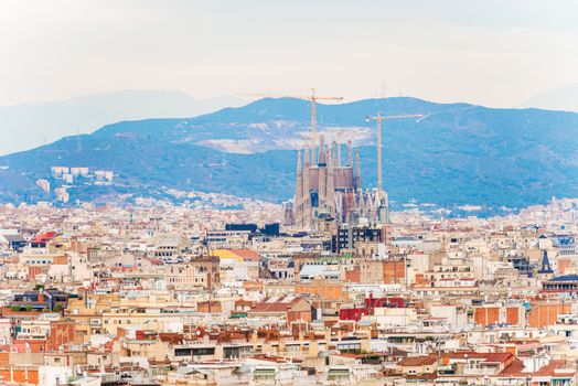 Barcelona, Spain - November 23: Aerial view at Barcelona on November 23, 2013. Famous Sagrada Familia Cathedral at the background.