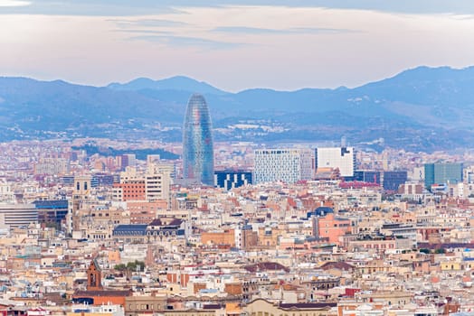 Barcelona, Spain - November 23: Aerial view at Barcelona on November 23, 2013. Famous Barcelona The Torre Agbar, Water Department Tower at the background.