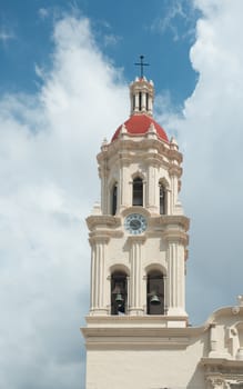 This is the very lovely Catedral de Santiago.The front facade is very exuberant and baroque. It has beautifully carved heavy wooden doors in the front. Inside the church has a single aisle and is mostly neo-classical with a central dome and real transepts. In the transepts, however, the neo-classical gives way to more baroque with gilded altars.