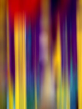 A background with stripes in bright blurred colorful pattern