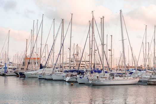 Vilanova i la Geltru, Spain - September 26: Sunset and view at sail boats in Vilanova i la Geltru marina on September 26, 2013.