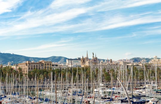 Barcelona, Spain - October 12: City of Barcelona landscape and sail boats in Port Vell.  Port Vell is a waterfront harbour in Barcelona, Catalonia, Spain, and part of the Port of Barcelona. It was built as part of an urban renewal program prior to the 1992 Barcelona Olympics. 
