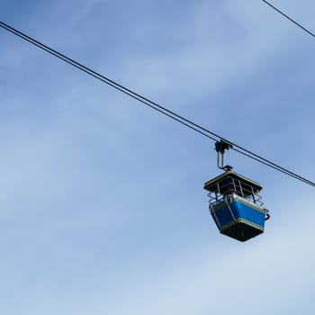 Cable car on the blue sky background