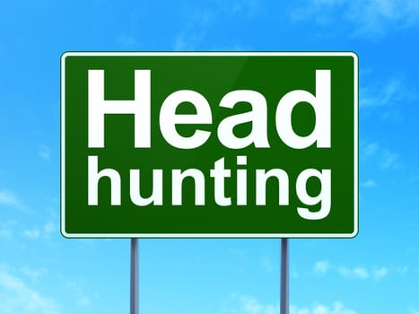 Business concept: Head Hunting on green road (highway) sign, clear blue sky background, 3d render