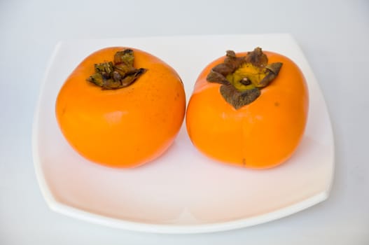 persimmon fruit on white background