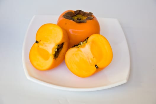 persimmon fruit on white background