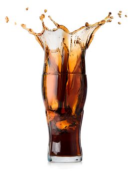 Splash of cola in a glass isolated on a white background