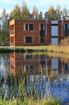 modern wooden  residential building on the lake