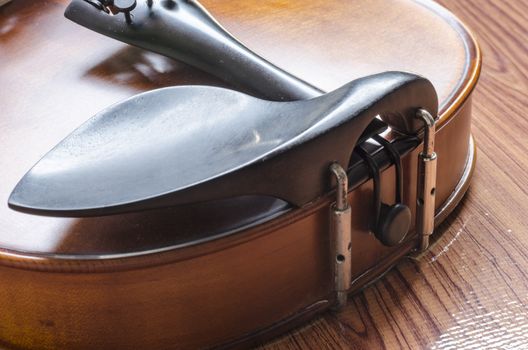 string instrument "violin" on wood background