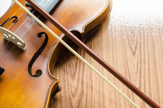 string instrument "violin" on wood background