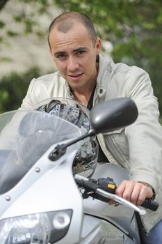 Young man with motorcycle