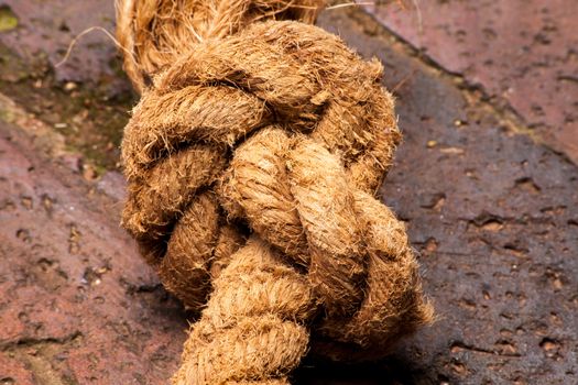 Knotted natural fibre rope.