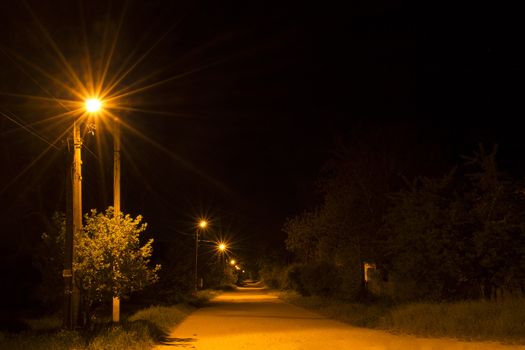 Night country road with a street lamps