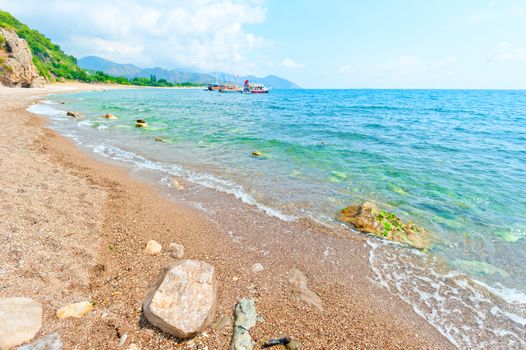 calm turquoise sea and rocky shore