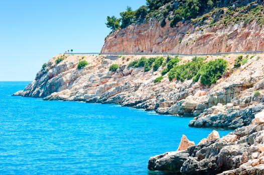 rocky landscape and a blue calm sea