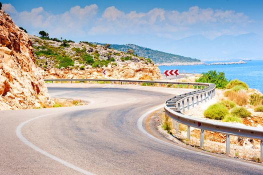 road in the mountains turns sharply over the mountain