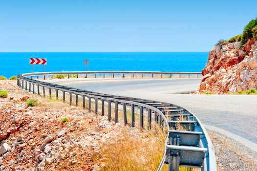 Sea and mountain highway fenced striker