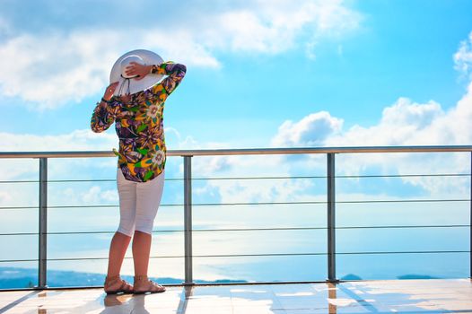 woman enjoys the view from the heights