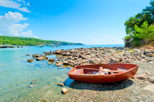 old boat on a rocky seashore