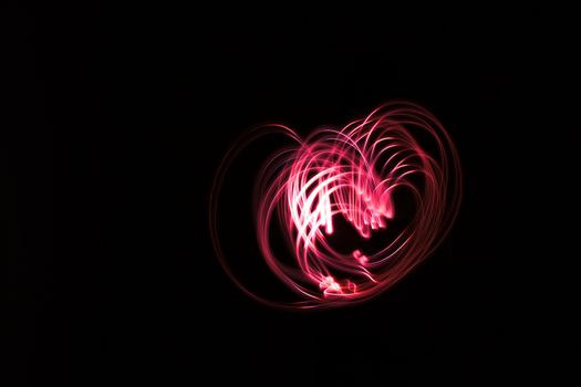 Heart shape light. Abstract forms of light in long exposure.