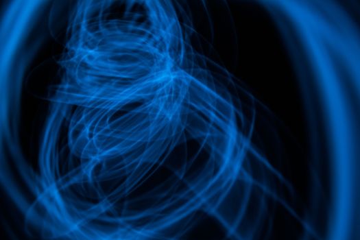 Curved bluish lines. Abstract forms of light in long exposure.