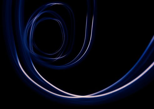 Curved blue and white lines. Abstract wave  forms of light in long exposure.