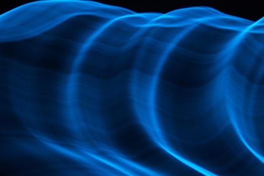 Curved bluish lines. Abstract forms of light in long exposure.