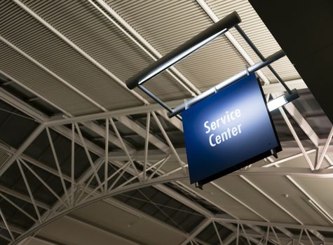 Blue Signage Marks the Customer Service Center in a Public Building Shoipping Structure